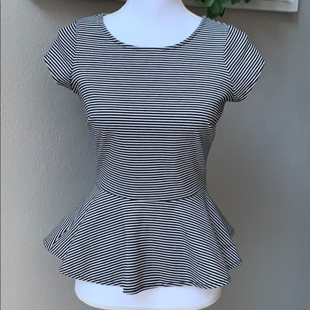 The limited zipper back peplum blouse